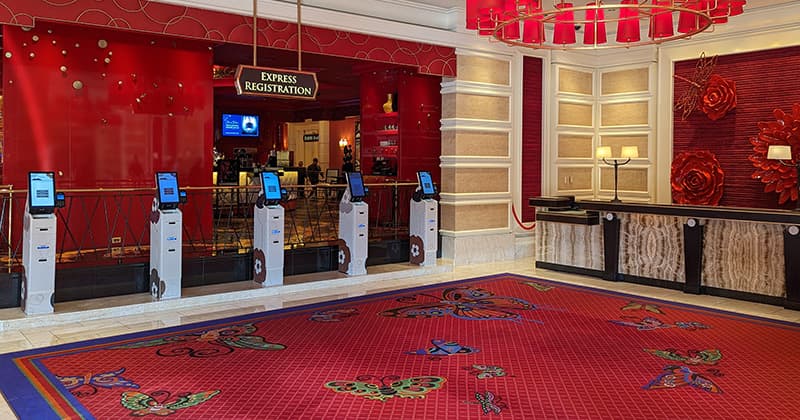Kiosk positioned close to the front desk with a well-name sign calling out the benefit. 