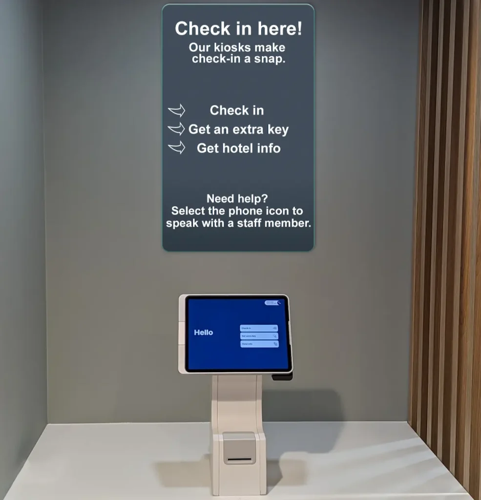 Signage above the kiosk to help educate guests on its use.